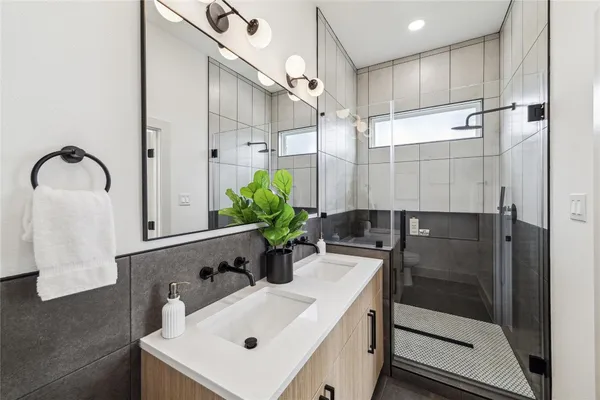 a bathroom with a sink and mirror