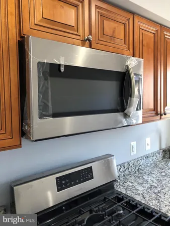 a kitchen with a stove and a microwave