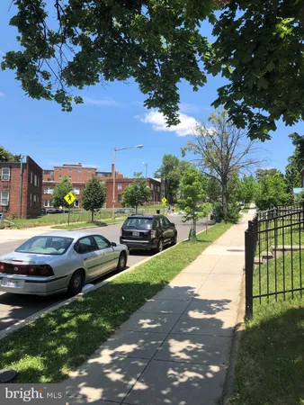 a view of multiple houses with yard