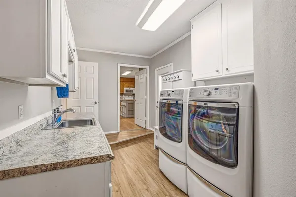 a kitchen with refrigerator and cabinets