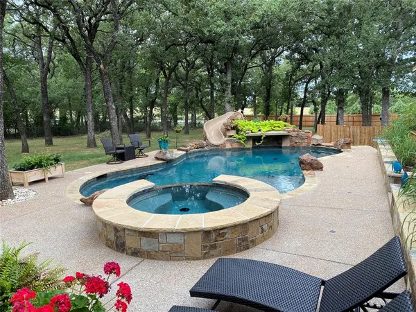 a view of a backyard with sitting area and fire pit