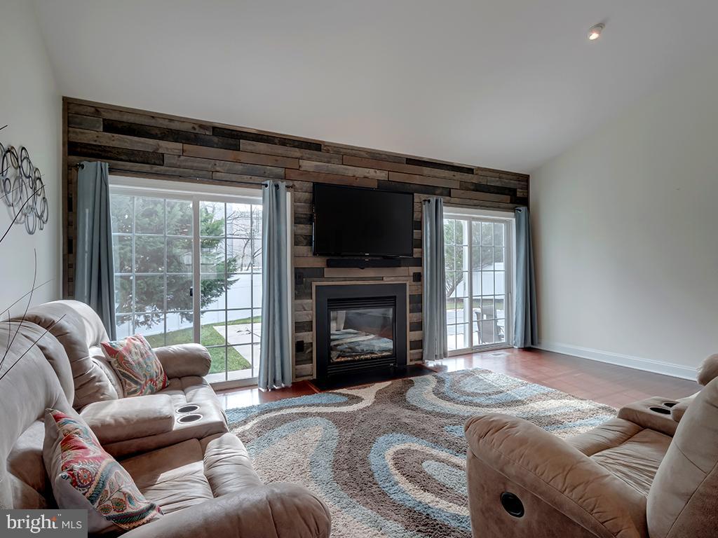 213 Sassafras Lane Milton, DE 19968 - Photo 11 of 36 Gas fireplace flanked by sliders