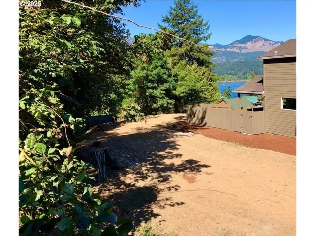 a view of a backyard of the house