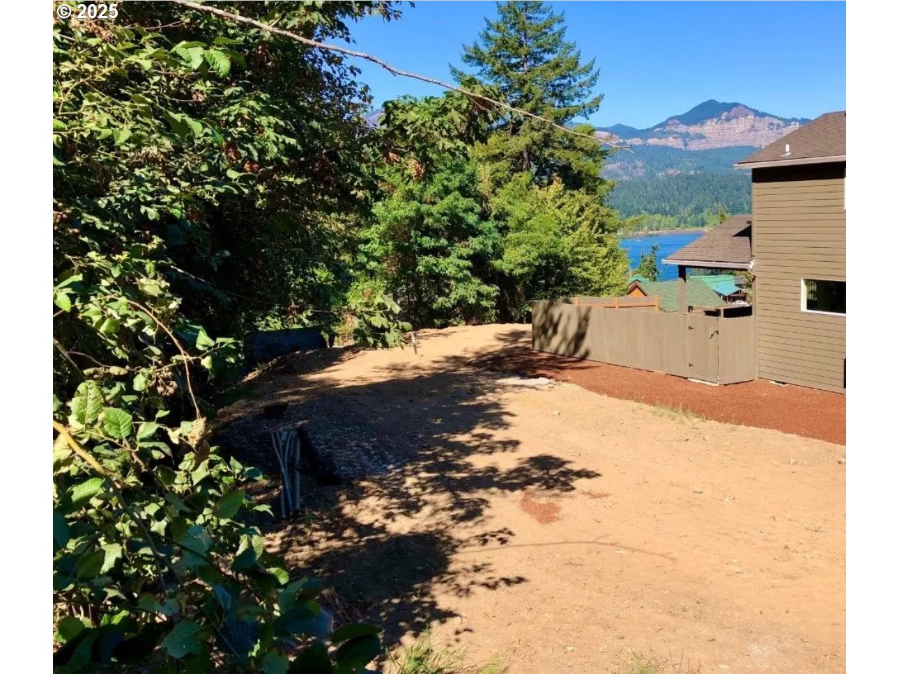 725 Southwest Moody Avenue Cascade Locks, OR 97014 - Photo 1 of 7 a view of a backyard of the house