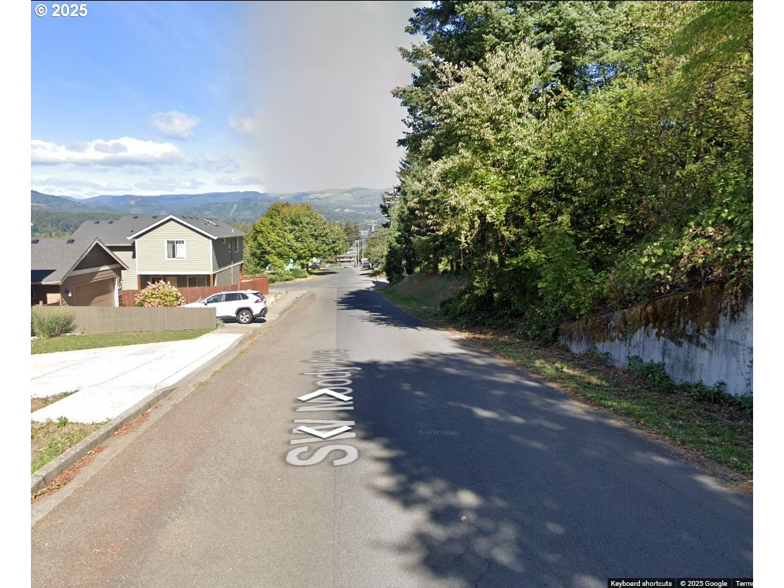 725 Southwest Moody Avenue Cascade Locks, OR 97014 - Photo 4 of 7 a view of a road with a yard