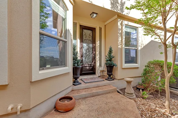 a front view of a house with sitting area