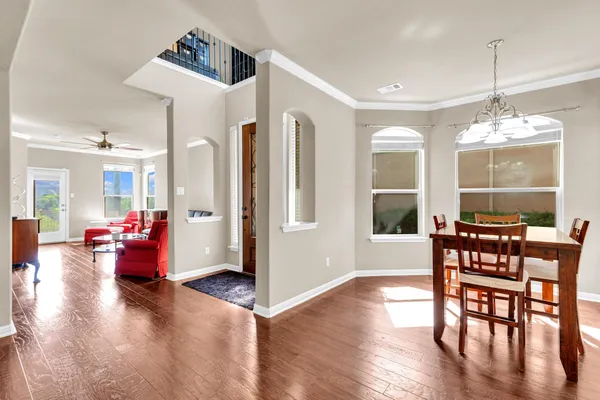 a view of a livingroom with furniture window and wooden floor