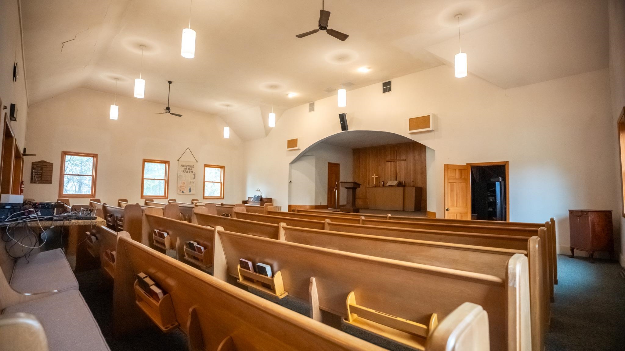 307 West Main Street Monroe Center, IL 61052 - Photo 16 of 31 a living room with stainless steel appliances kitchen island a large counter top a stove and a chandelier