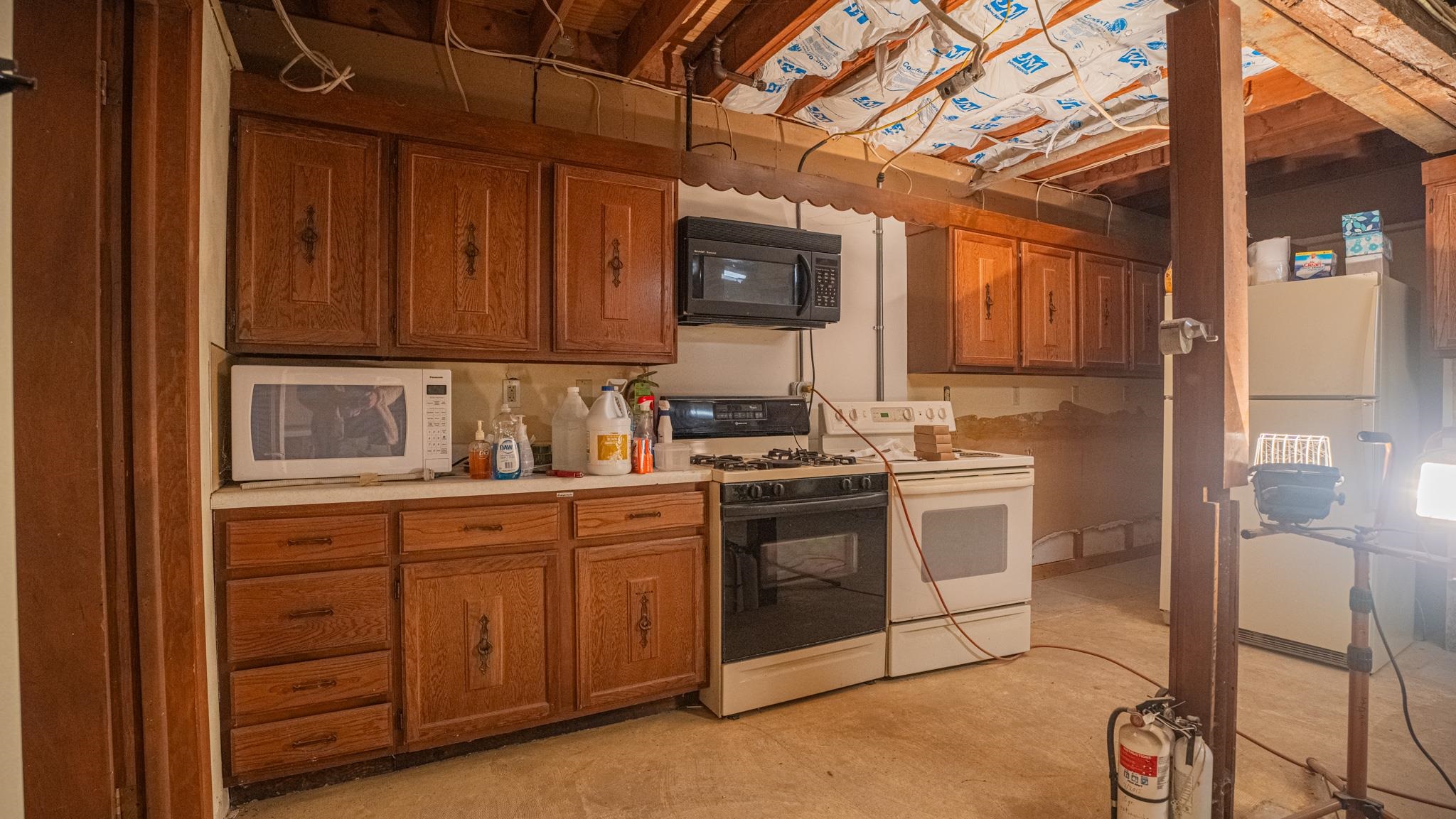 307 West Main Street Monroe Center, IL 61052 - Photo 26 of 31 a kitchen with a sink cabinets and appliances