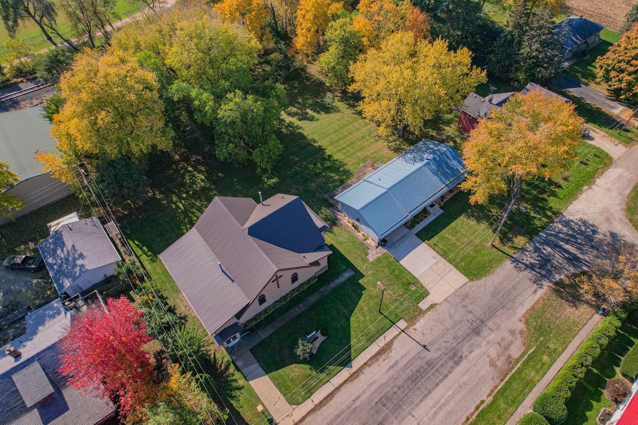 307 West Main Street Monroe Center, IL 61052 - Photo 8 of 31 an aerial view of a house with a garden