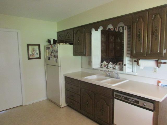 10 Barns Road Leoma, TN 38468 - Photo 5 of 19 a kitchen with a sink and a refrigerator