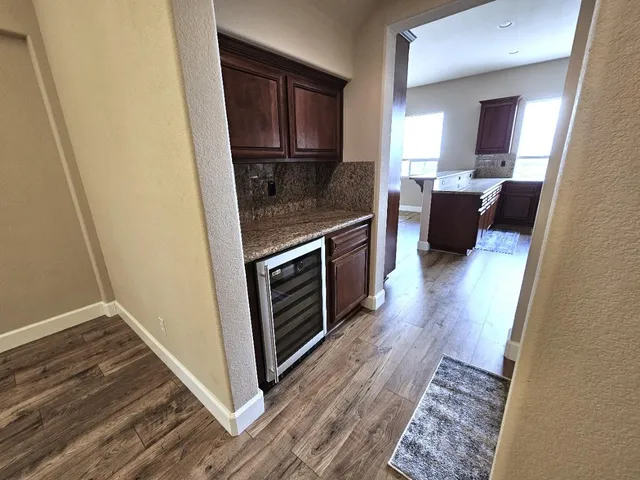 a view of balcony with wooden floor and city view
