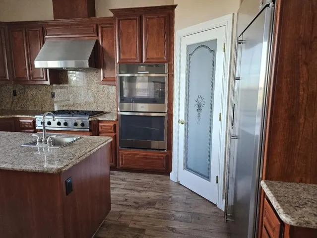 a bathroom with a bathtub and a sink