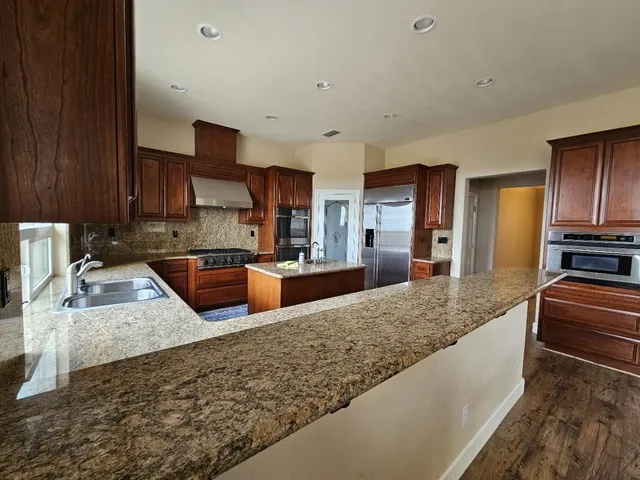 a view of a kitchen with dishwasher and a window