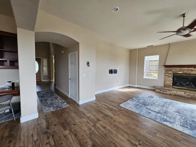 a view of a patio with couches table and chairs and potted plants