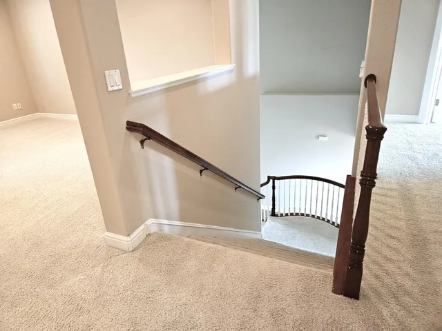 a view of a patio with table and chairs and potted plants