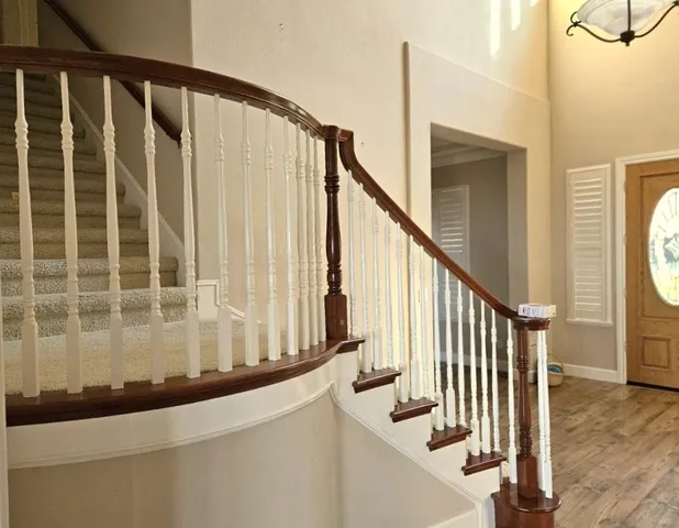 a kitchen with wooden floor and a sink