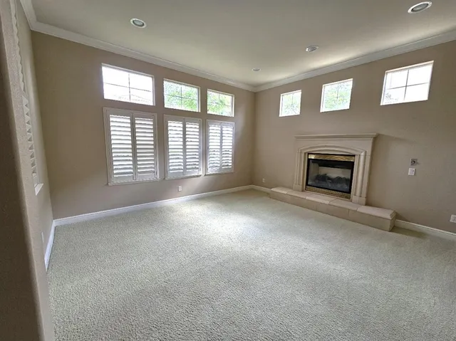 a kitchen with stainless steel appliances granite countertop a refrigerator a stove and a sink