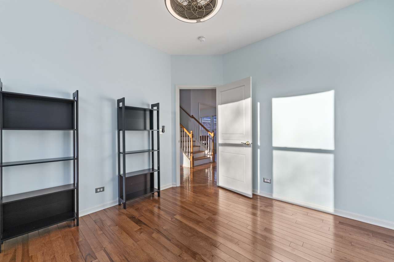 149 Lilac Street Bolingbrook, IL 60490 - Photo 18 of 50 a view of empty room with wooden floor and window
