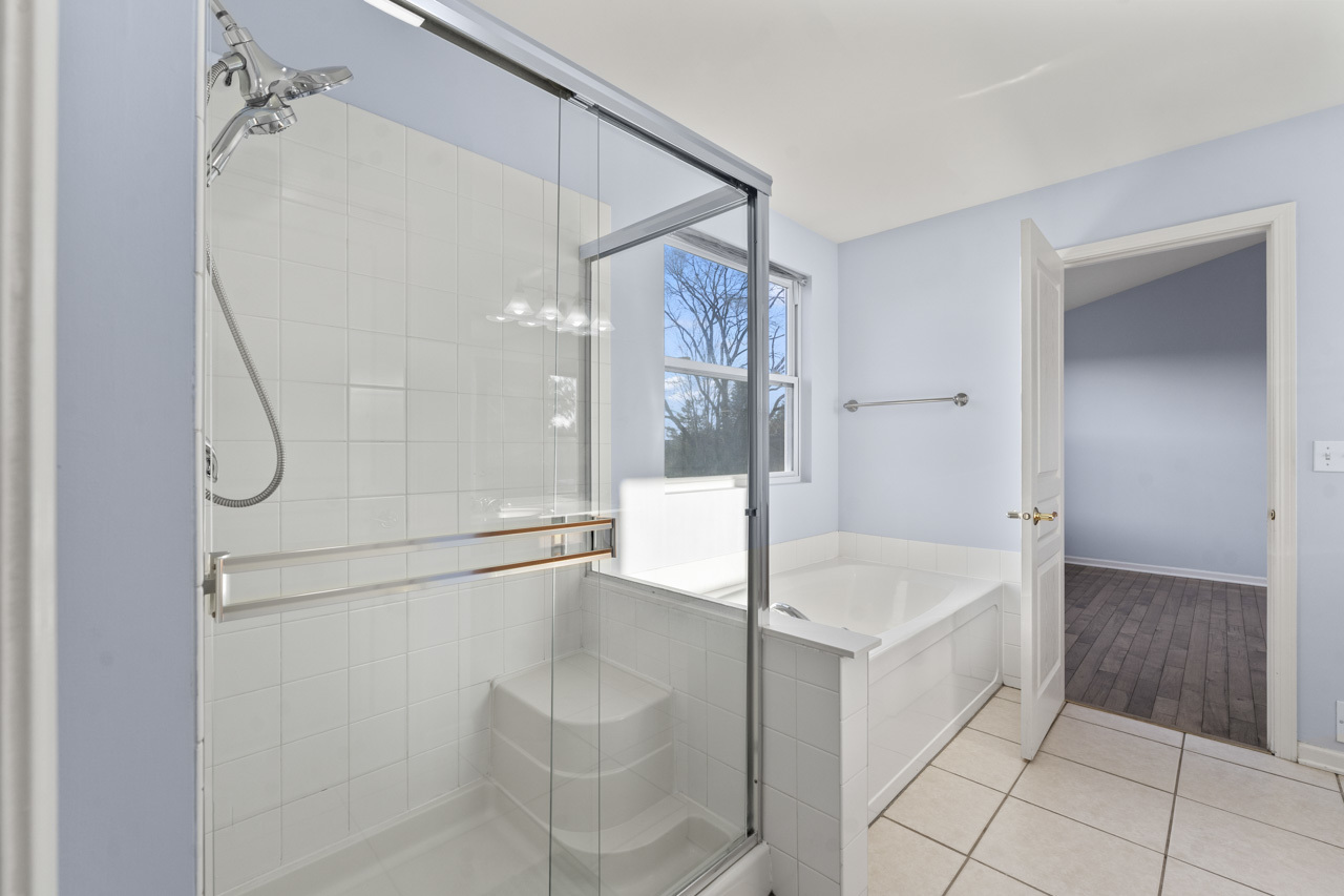 149 Lilac Street Bolingbrook, IL 60490 - Photo 25 of 50 a bathroom with a bathtub and a shower
