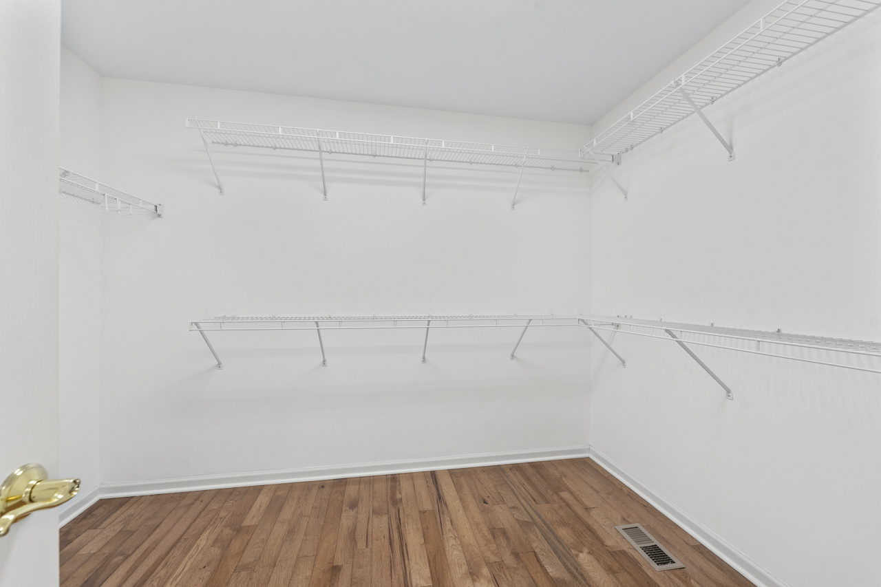 149 Lilac Street Bolingbrook, IL 60490 - Photo 26 of 50 a view of a room with racks on the wall