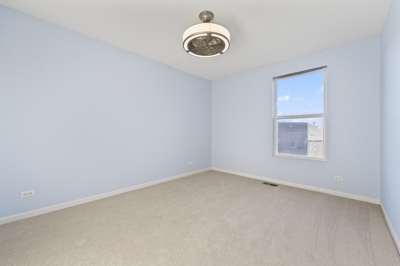 149 Lilac Street Bolingbrook, IL 60490 - Photo 29 of 50 an empty room with a window