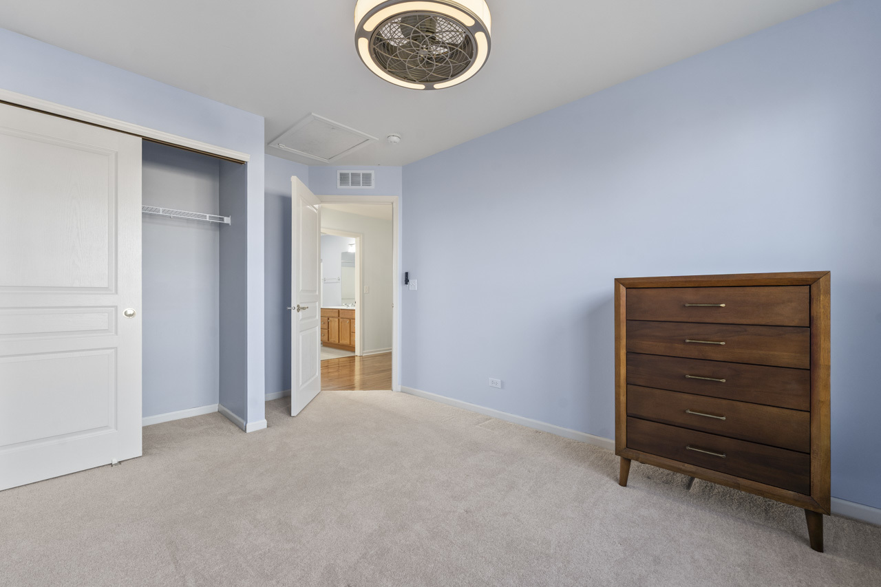 149 Lilac Street Bolingbrook, IL 60490 - Photo 32 of 50 a view of empty room with a ceiling fan