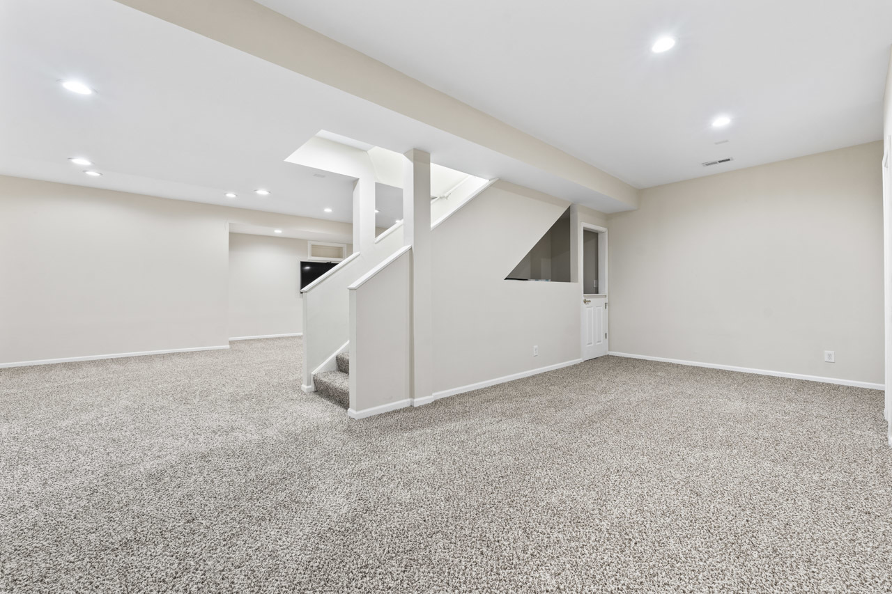 149 Lilac Street Bolingbrook, IL 60490 - Photo 37 of 50 an empty room with white walls and stairs