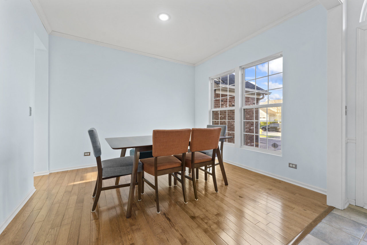 149 Lilac Street Bolingbrook, IL 60490 - Photo 4 of 50 a view of a dining room with furniture and wooden floor