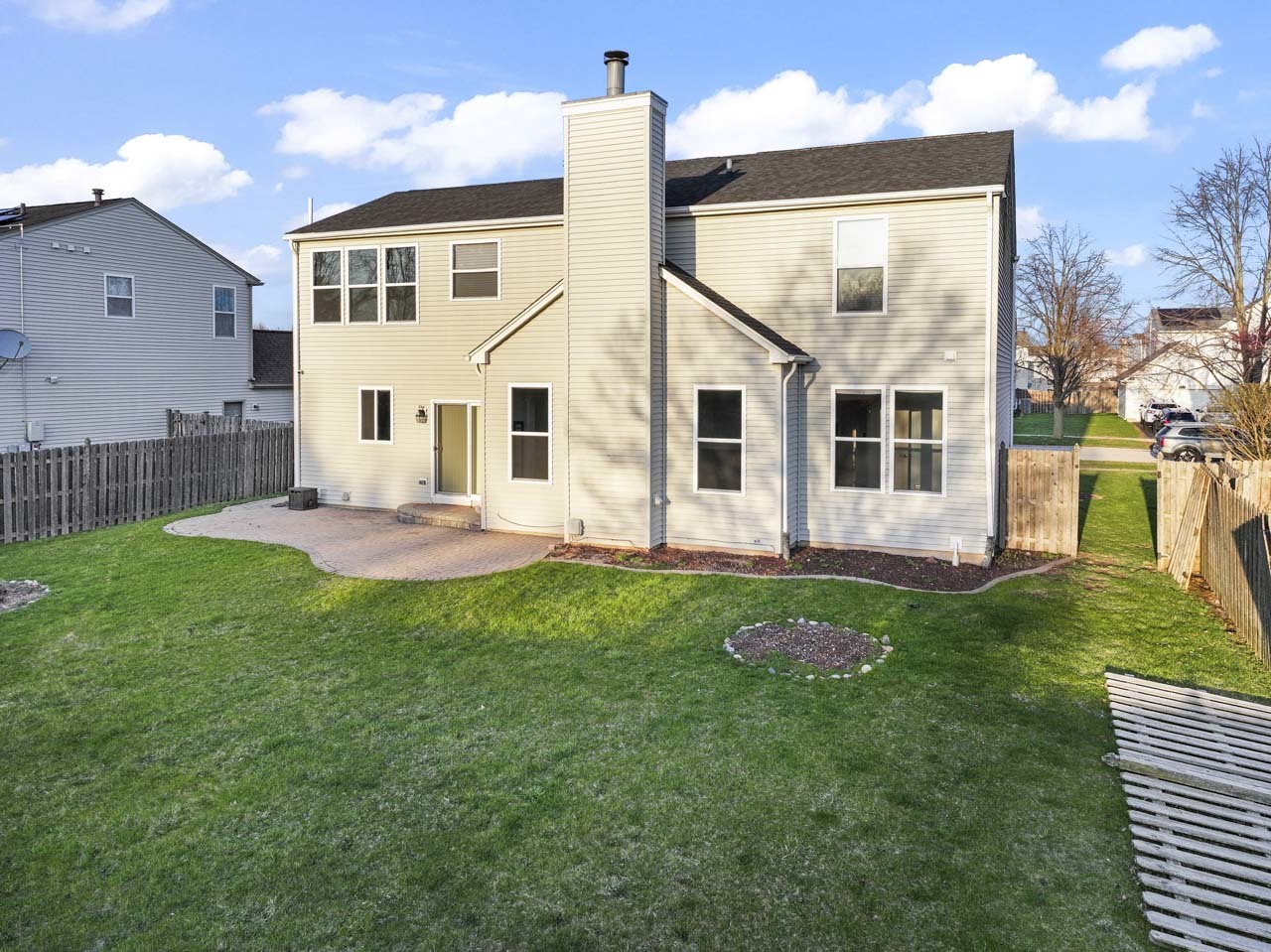 149 Lilac Street Bolingbrook, IL 60490 - Photo 42 of 50 a backyard of a house with table and chairs
