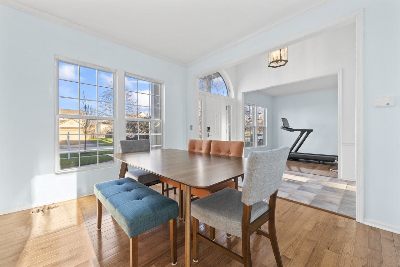 149 Lilac Street Bolingbrook, IL 60490 - Photo 5 of 50 a view of a dining room with furniture and wooden floor