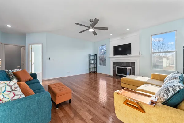 a living room with furniture fireplace and a flat screen tv