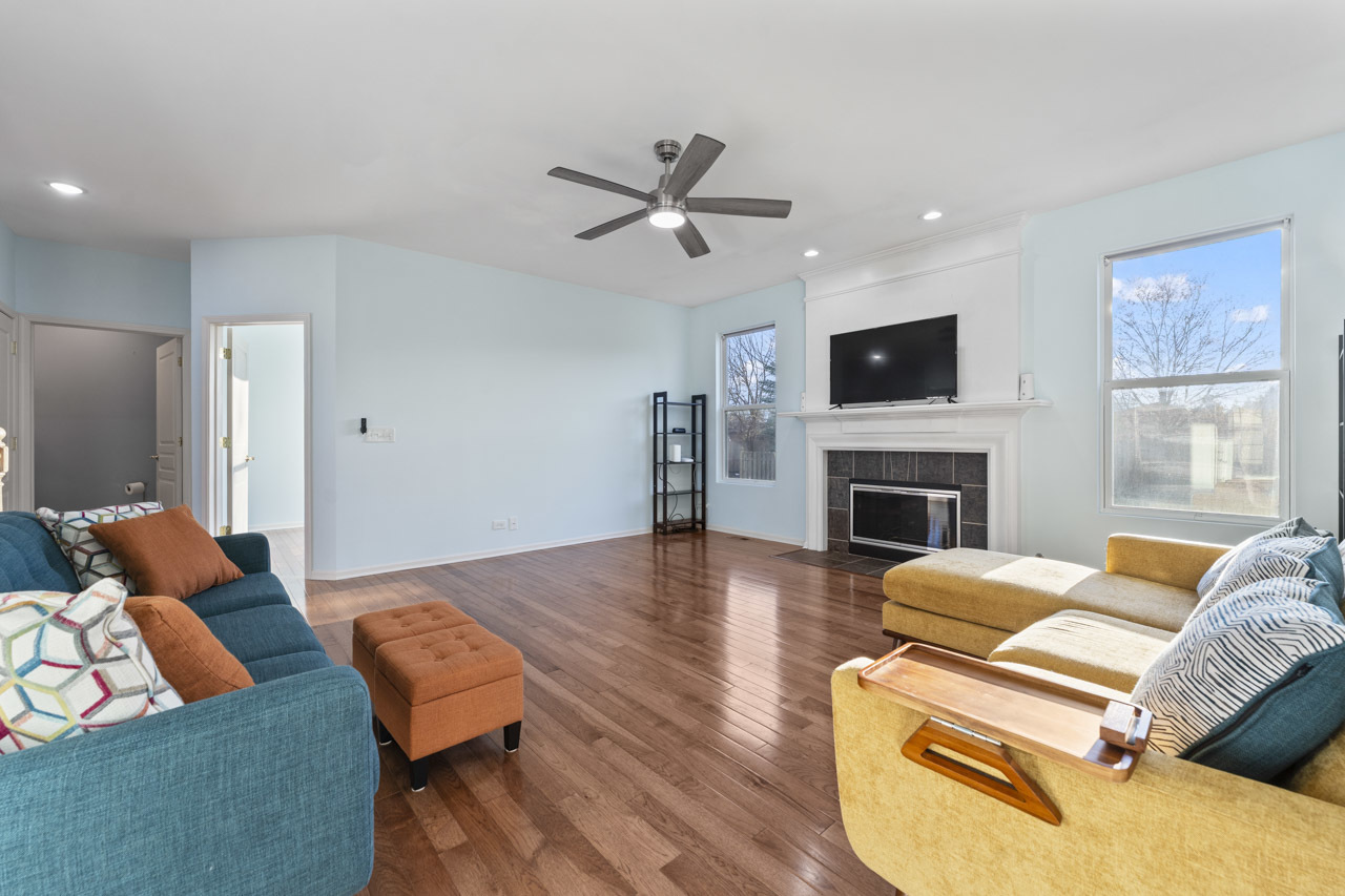 149 Lilac Street Bolingbrook, IL 60490 - Photo 8 of 50 a living room with furniture fireplace and a flat screen tv