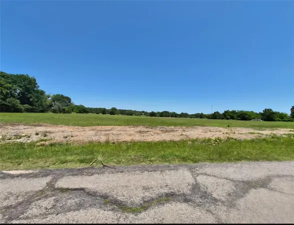 a view of a lake with a big yard