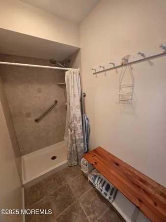 a bathroom with a tub and a shower