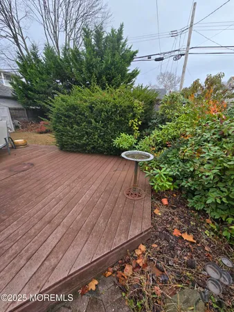 a backyard of a house with fire pit and outdoor seating