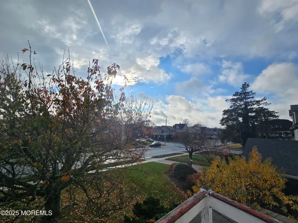 a view of a garden and swimming pool