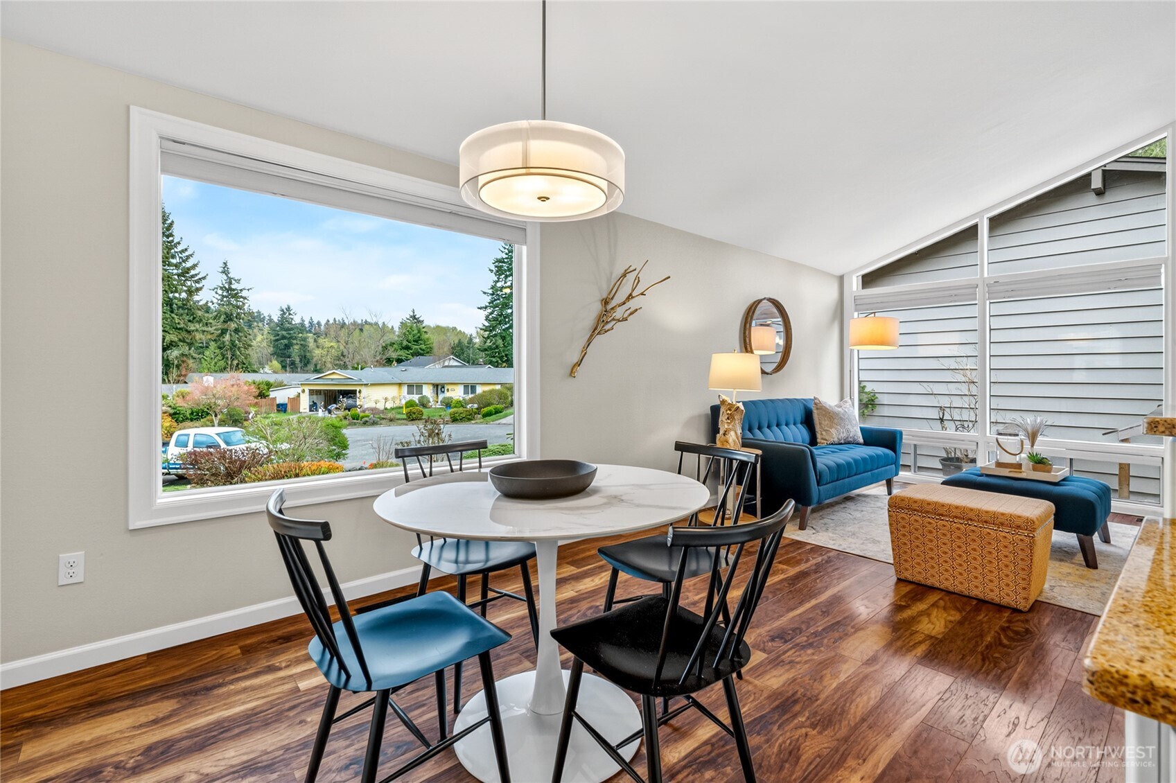 13236 Southeast 161st Place Renton, WA 98058 - Photo 11 of 38 a dining room with furniture a large window and wooden floor