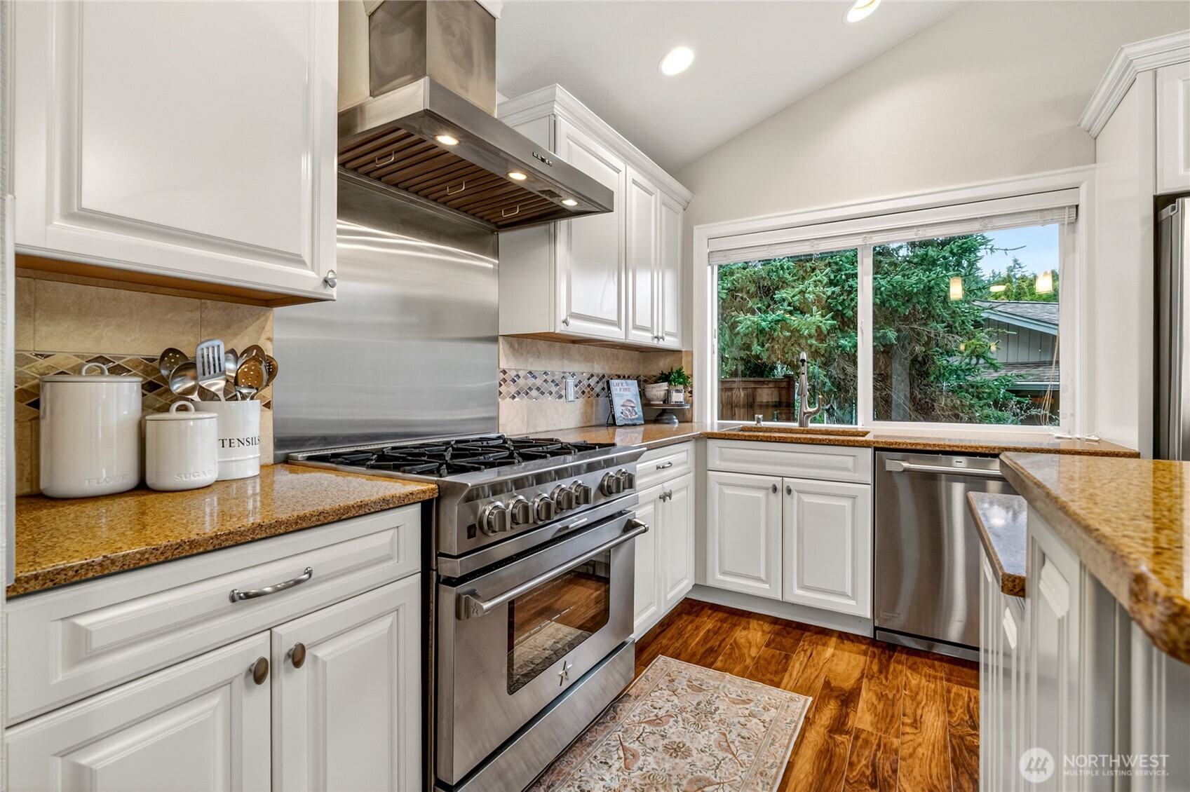 13236 Southeast 161st Place Renton, WA 98058 - Photo 16 of 38 a kitchen with a stove and a sink