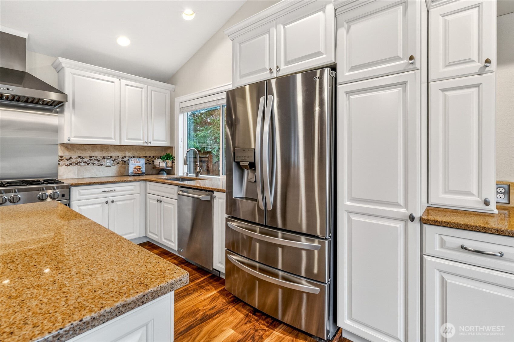 13236 Southeast 161st Place Renton, WA 98058 - Photo 17 of 38 a kitchen with granite countertop stainless steel appliances and counter space