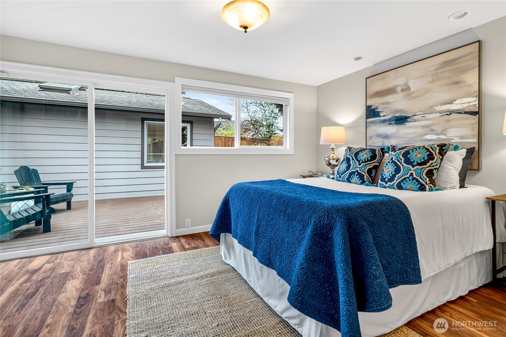 13236 Southeast 161st Place Renton, WA 98058 - Photo 20 of 38 a bedroom with a bed and lamp