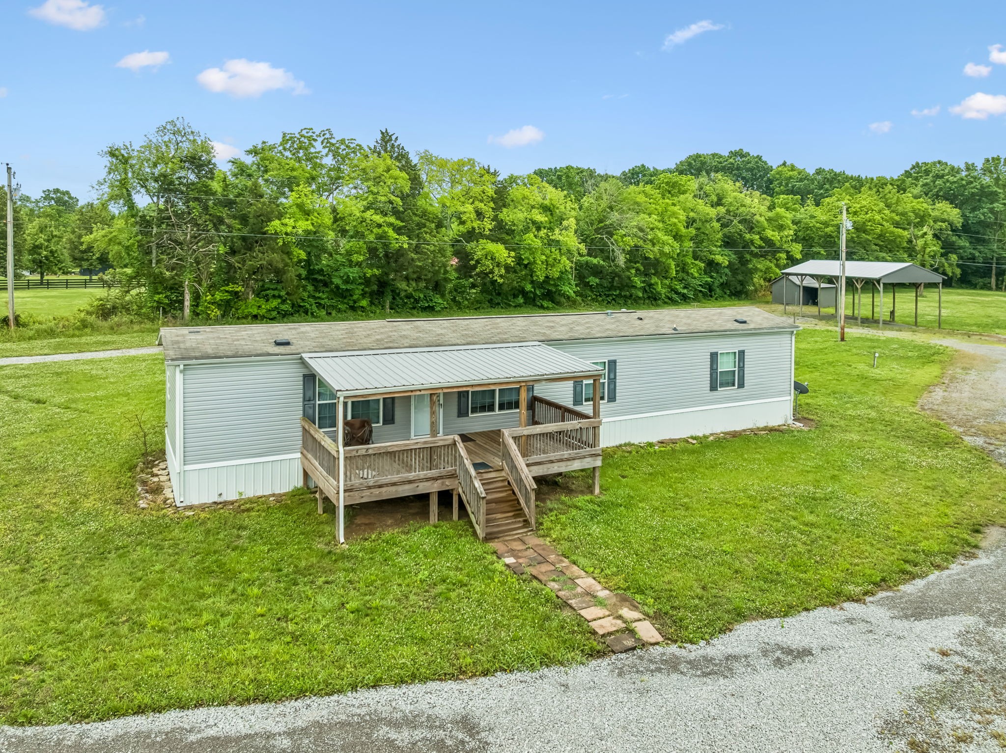 280 Kingdom Road Unionville, TN 37180 - Photo 20 of 65 a view of a patio with table and chairs with a garden