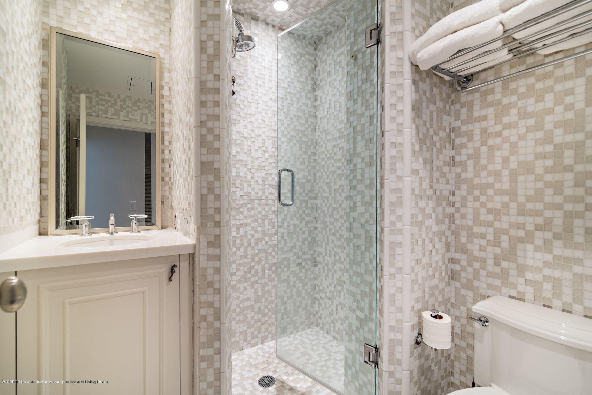 44 Cocoanut Row, Unit 326B Palm Beach, FL 33480 - Photo 10 of 19 a bathroom with a sink a toilet and shower