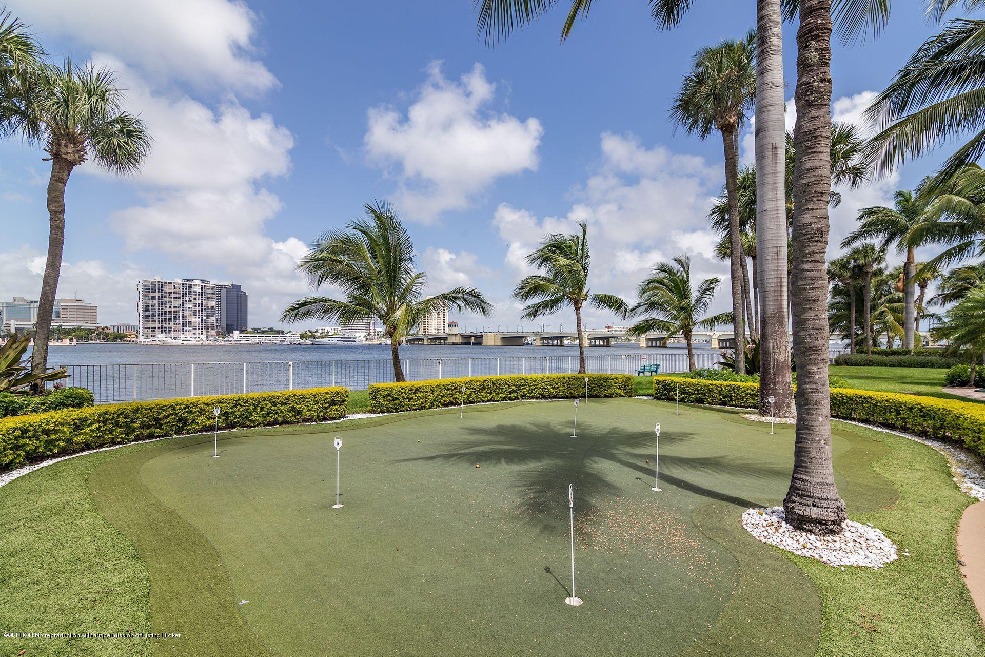 44 Cocoanut Row, Unit 326B Palm Beach, FL 33480 - Photo 15 of 19 a swimming pool with outdoor seating and yard