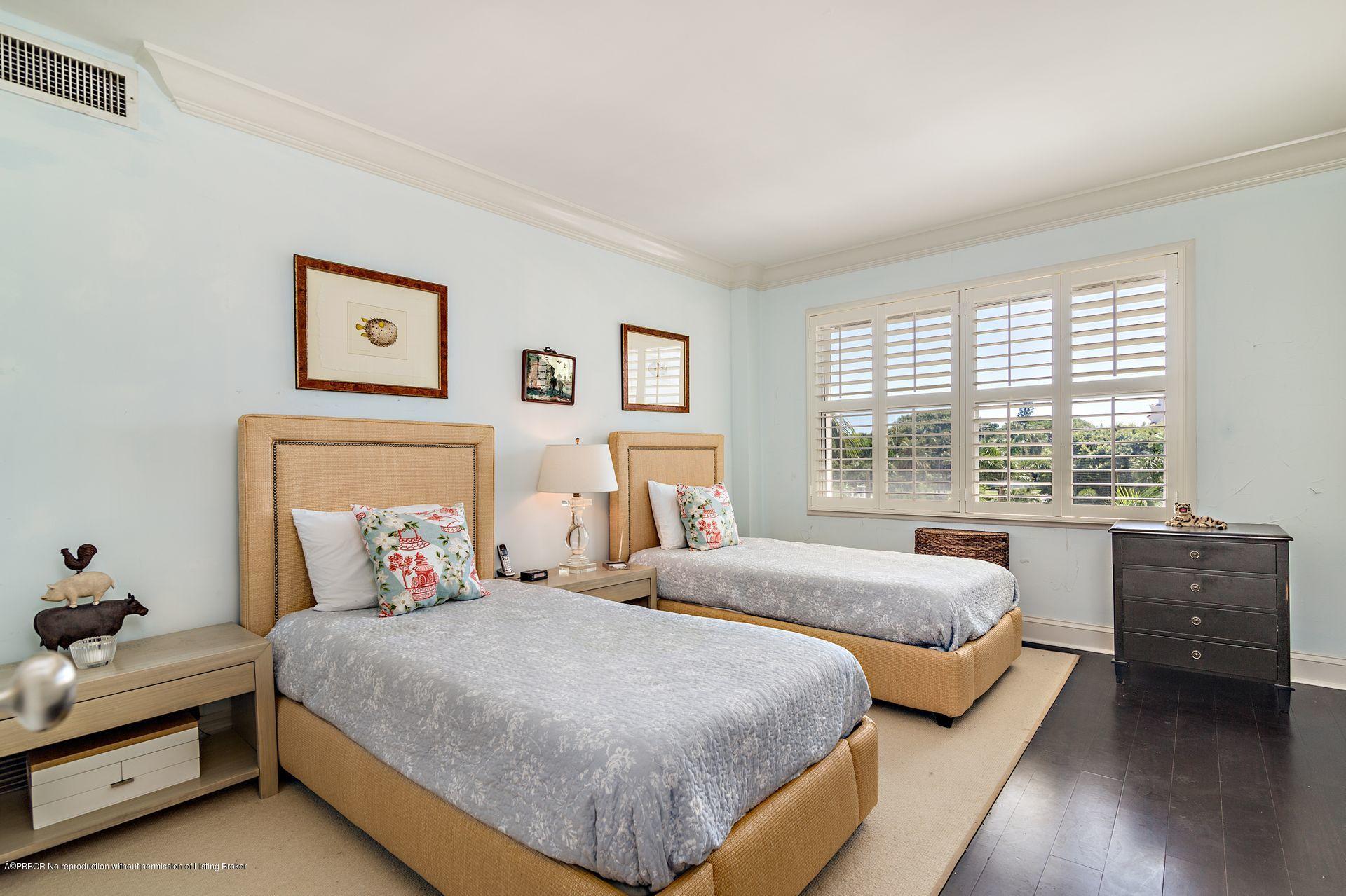 44 Cocoanut Row, Unit 326B Palm Beach, FL 33480 - Photo 7 of 19 a bedroom with a bed and wooden floor