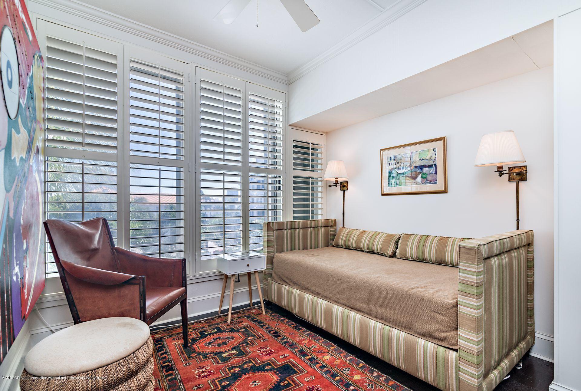 44 Cocoanut Row, Unit 326B Palm Beach, FL 33480 - Photo 8 of 19 a bedroom with a bed and wooden floor