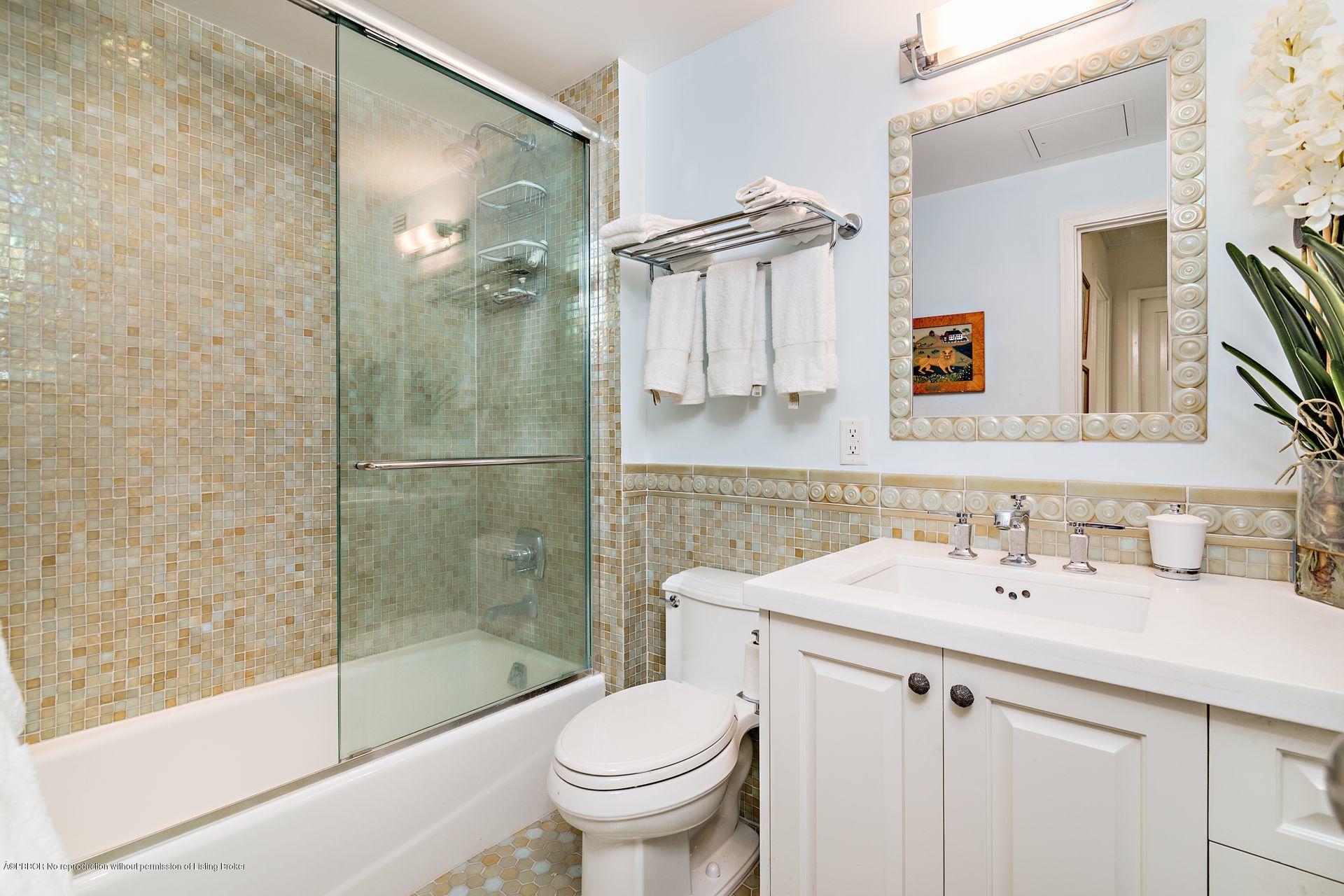 44 Cocoanut Row, Unit 326B Palm Beach, FL 33480 - Photo 9 of 19 a bathroom with a sink toilet and shower