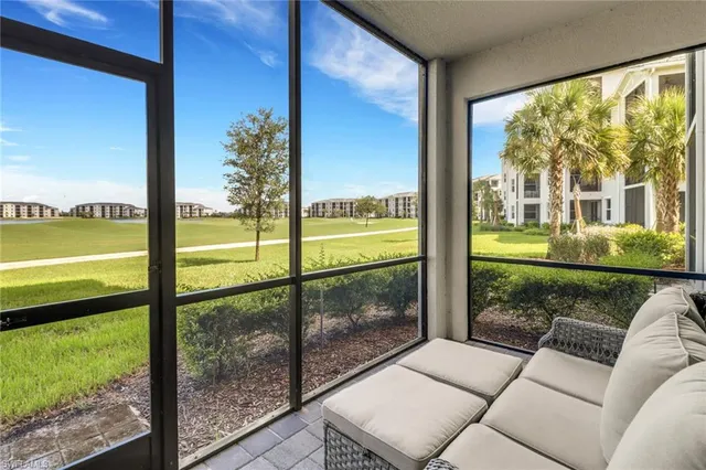 a view of a big yard with a building in the background