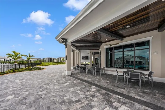 a view of a chairs and table in a patio