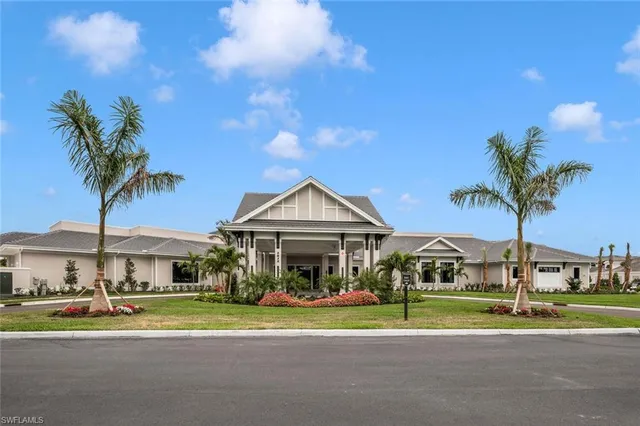 a lobby with furniture and a chandelier